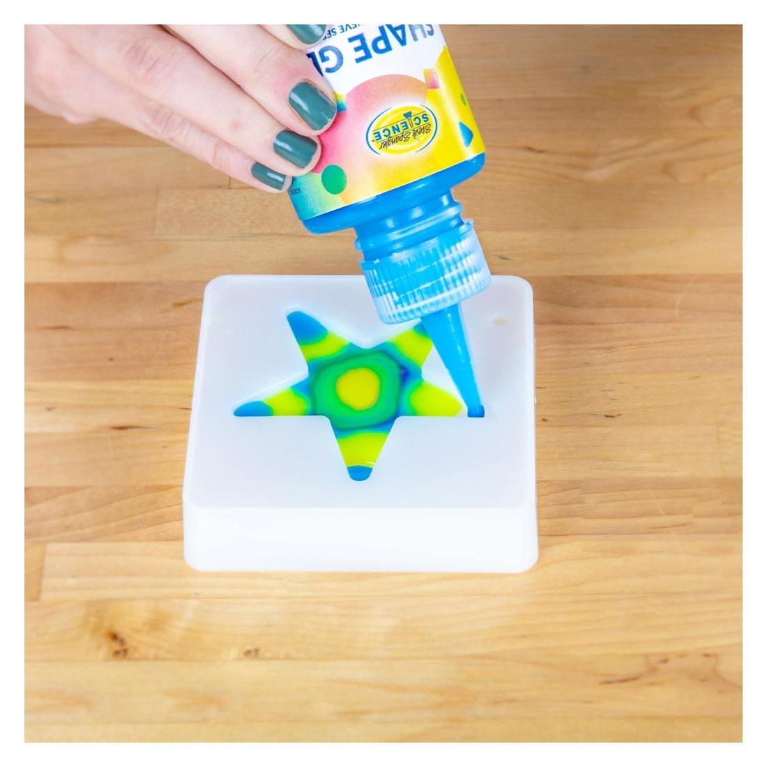 Hand creating a star using the Shape Gel By Steve Spangler Science