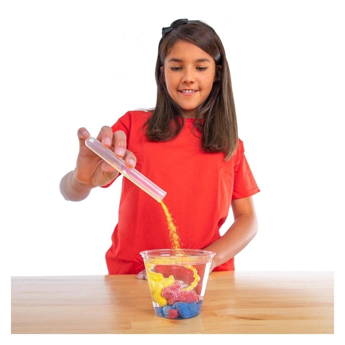 Child playing with Magic Sand Test Tubes By Steve Spangler Science