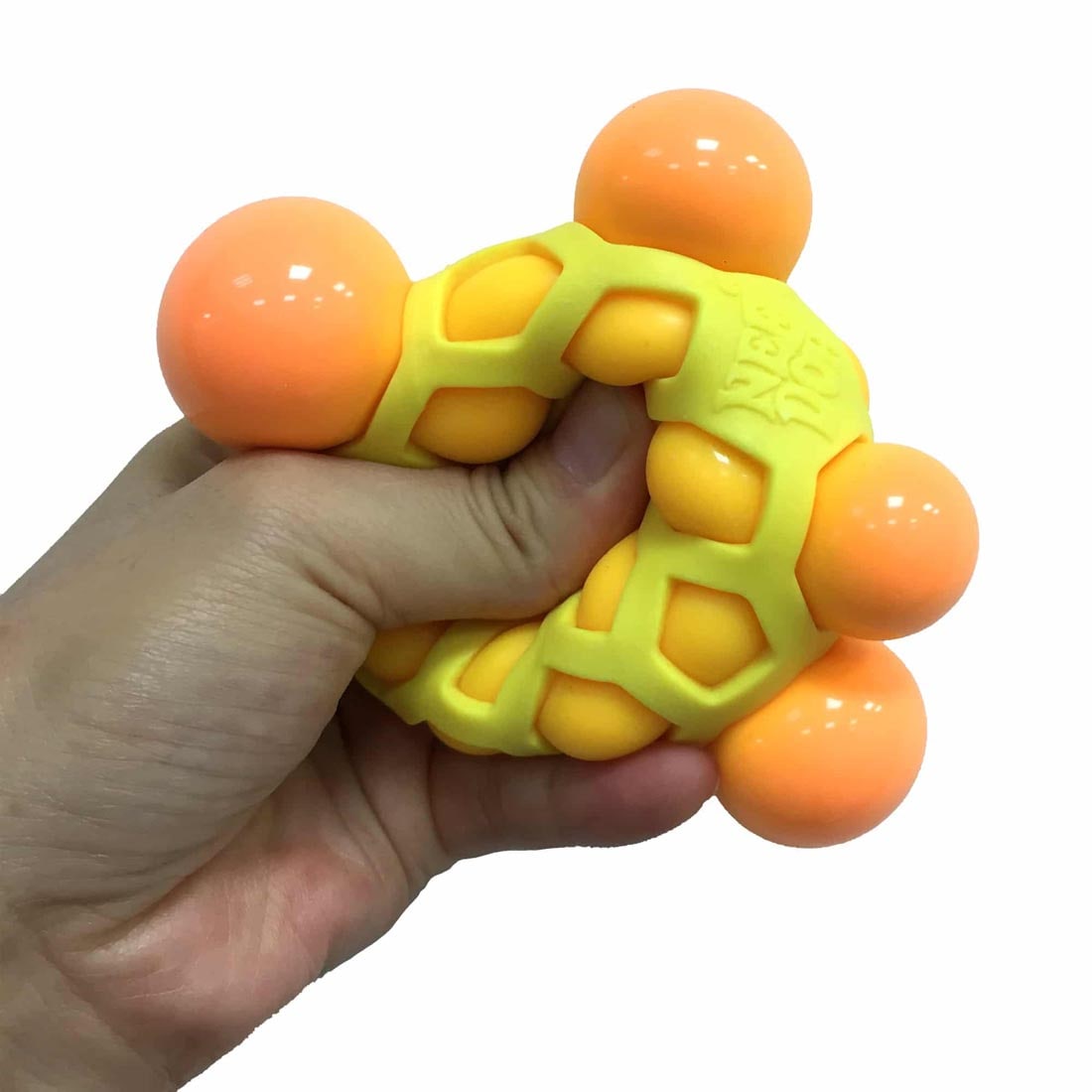 Hand squeezing an Atomic Nee Doh Stress Ball