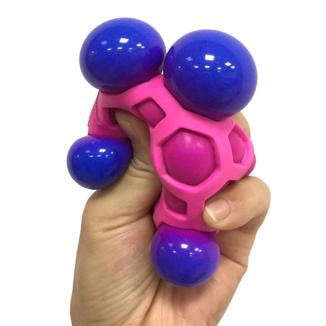 Hand squeezing an Atomic Nee Doh Stress Ball