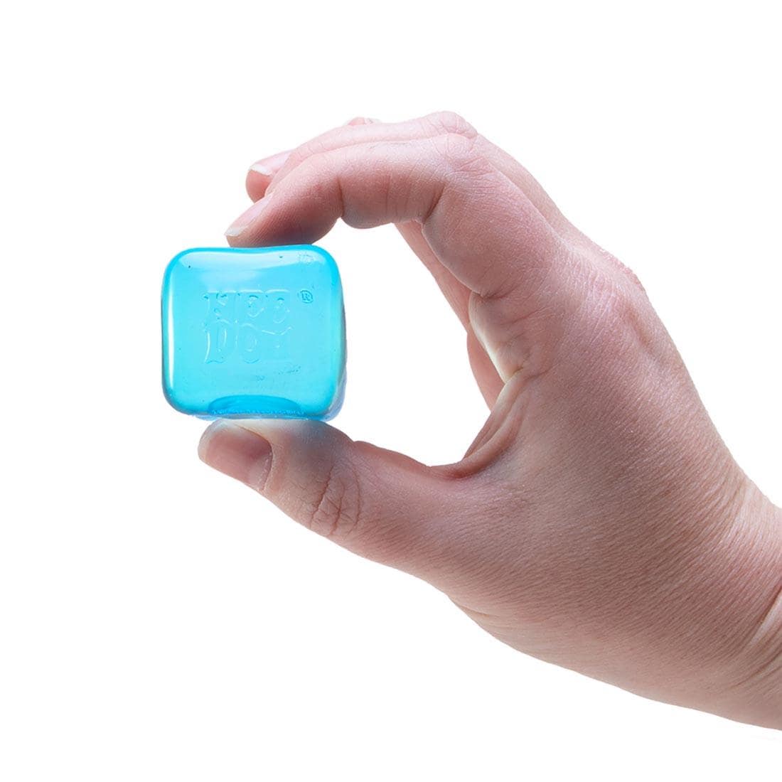 hand holding a blue Nee Doh Nice Ice Baby