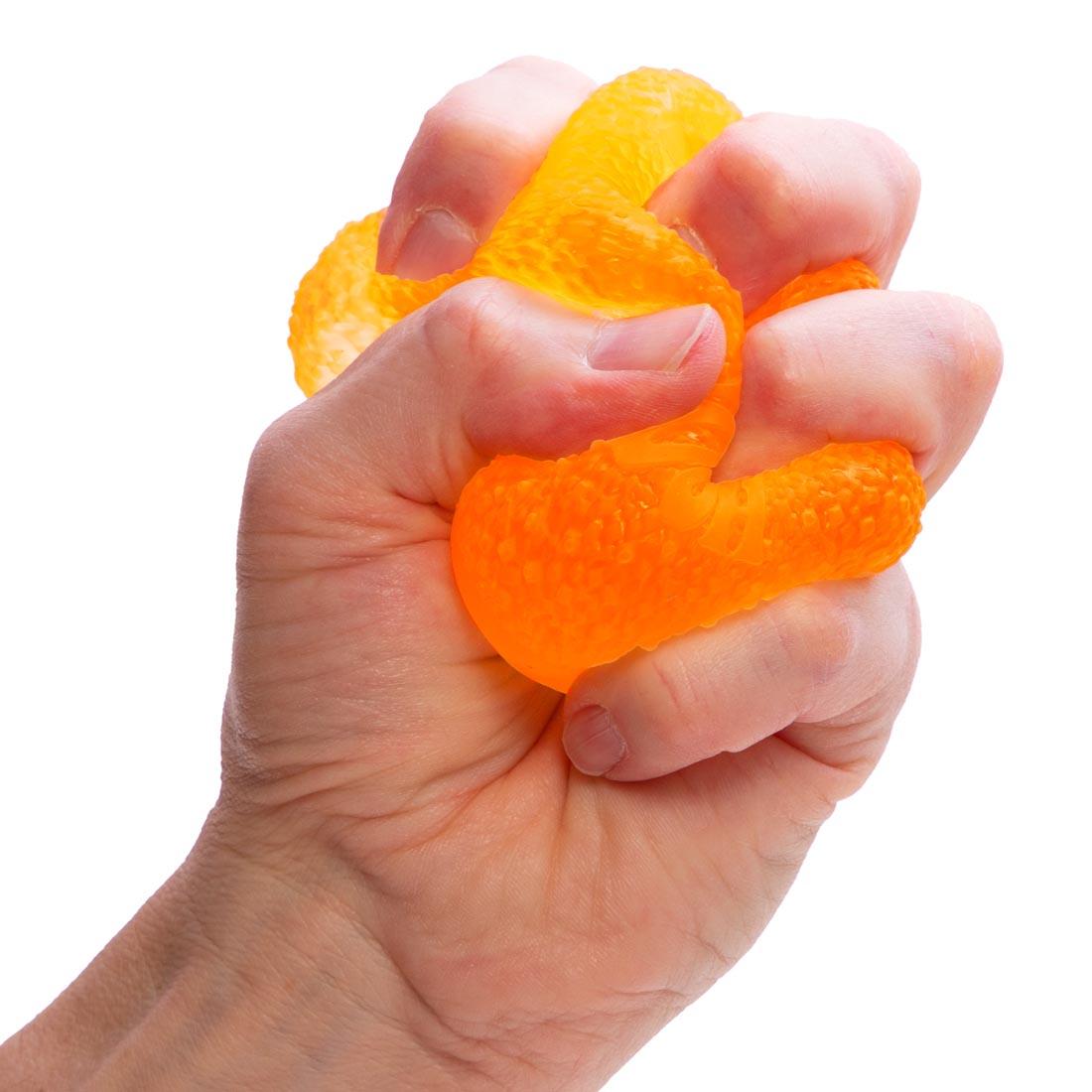 fist squeezing a Nee Doh Gumdrop