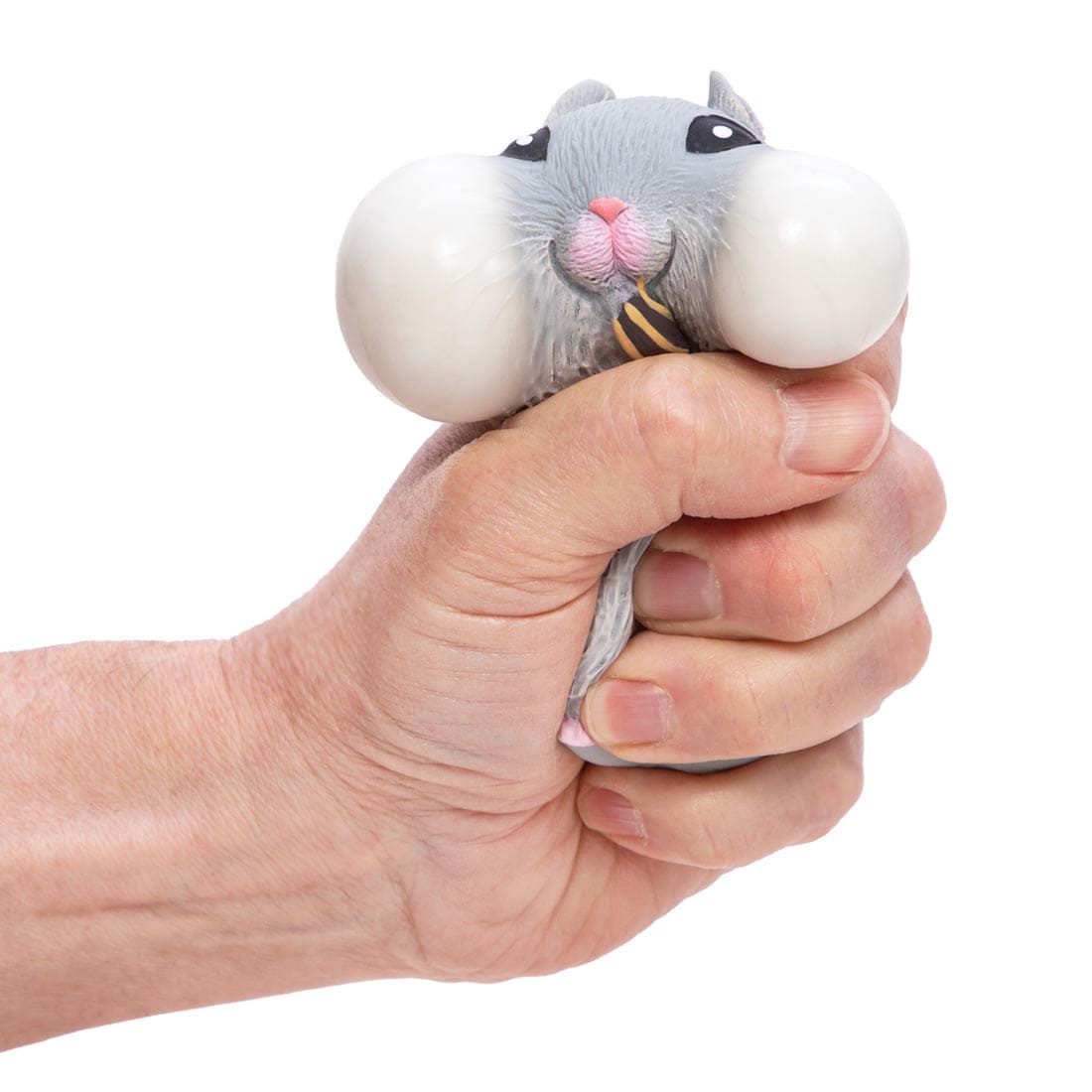 hand squeezing a Chonky Cheeks Hamster By Schylling Toys