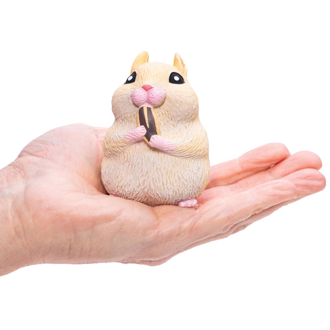 hand holding a Chonky Cheeks Hamster By Schylling Toys