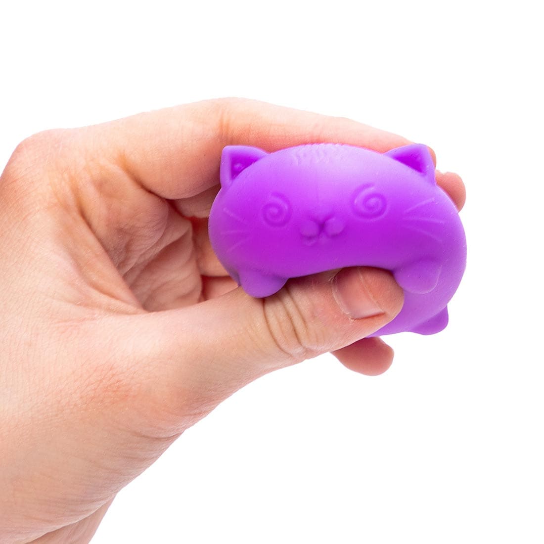 Hand squishing a Teenie Nee Doh Cool Cat with thumb and forefinger