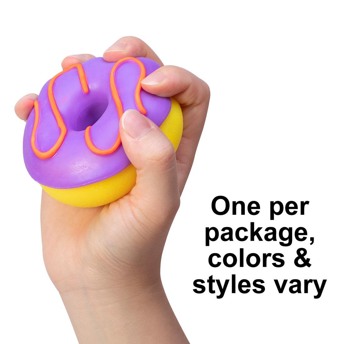 hand holding a Nee Doh Dohnut with text One per package, colors & styles vary