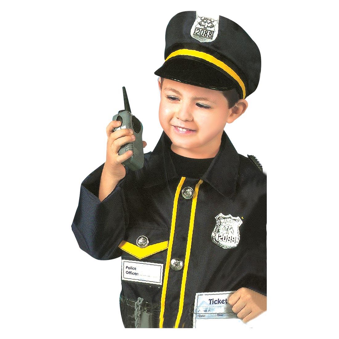child dressed in the Police Officer Role Play Costume using the walkie talkie