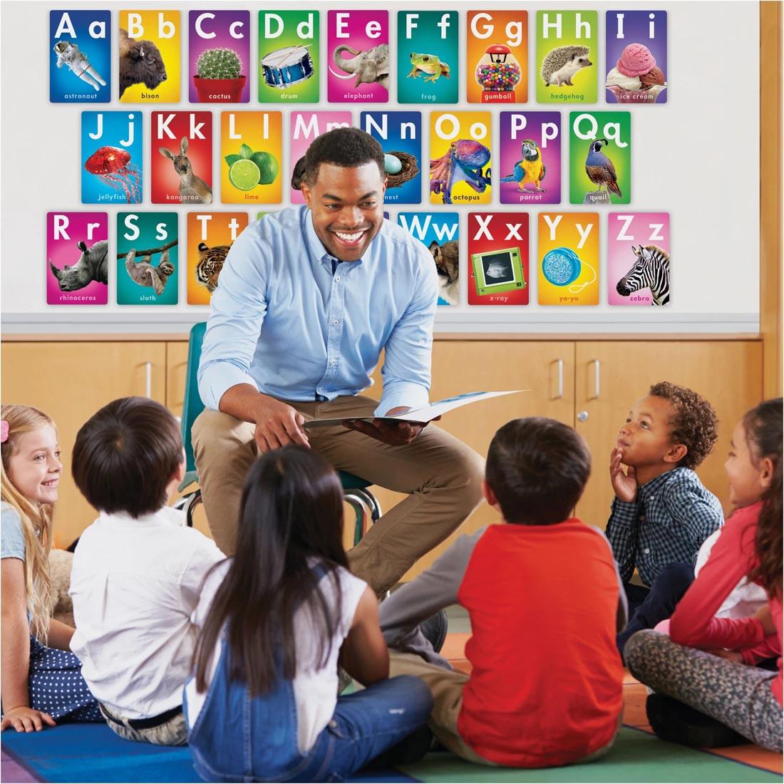 Teacher in classroom of children with the TREND ABC Photo Fun Learning Set on display