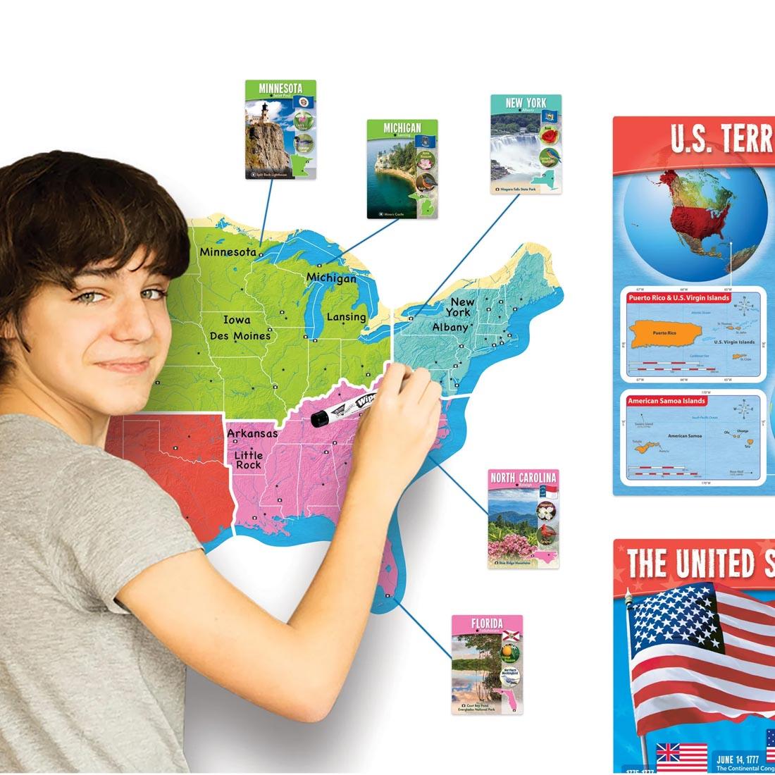 person writing on the map of the TREND The United States Wipe-Off Learning Set