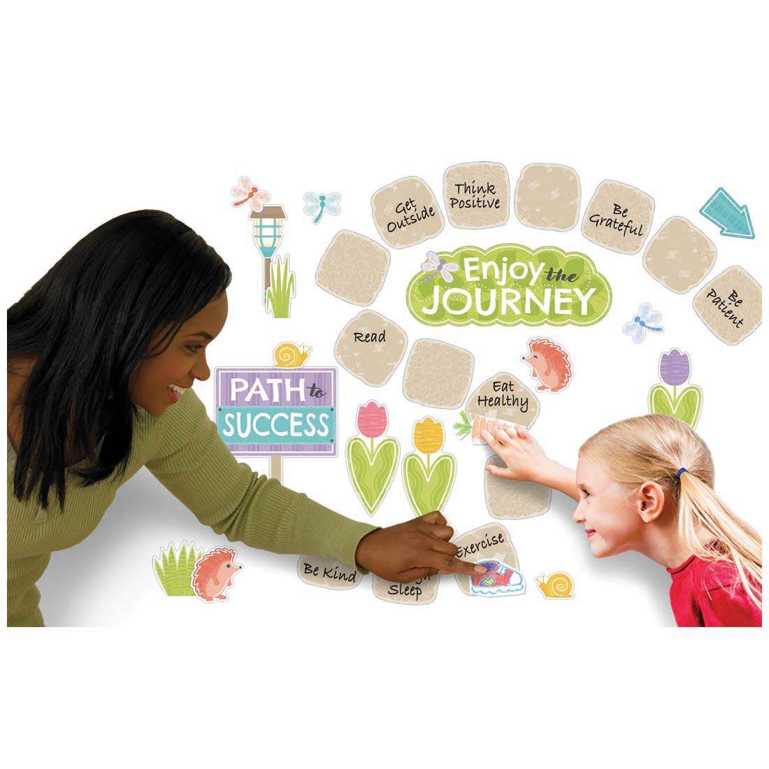 adult and child interacting with the Stepping Stones Learning Set from the Good To Grow collection by TREND