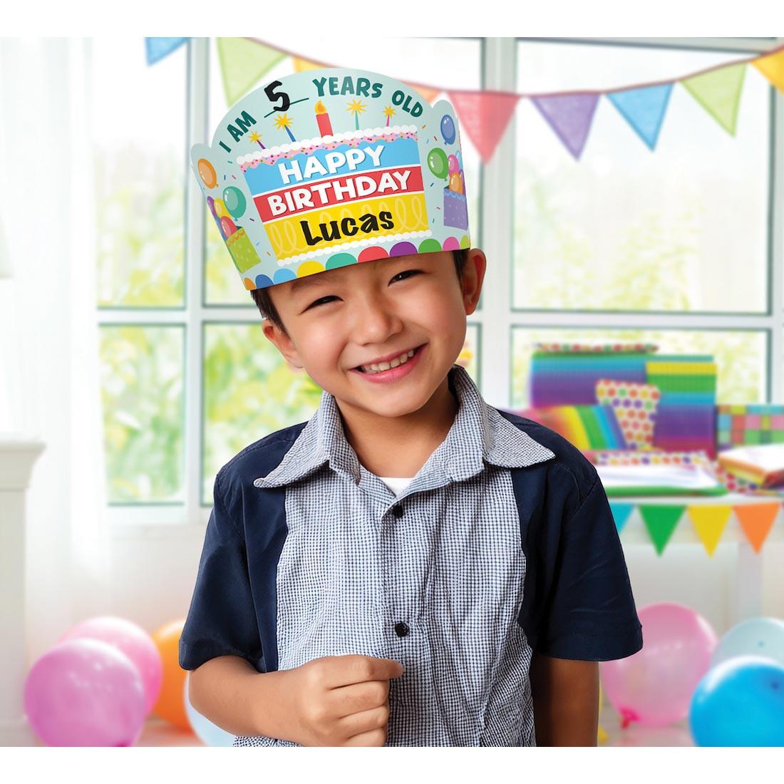 child wearing a Happy Birthday Crown from the Colorful collection by Teacher Created Resources