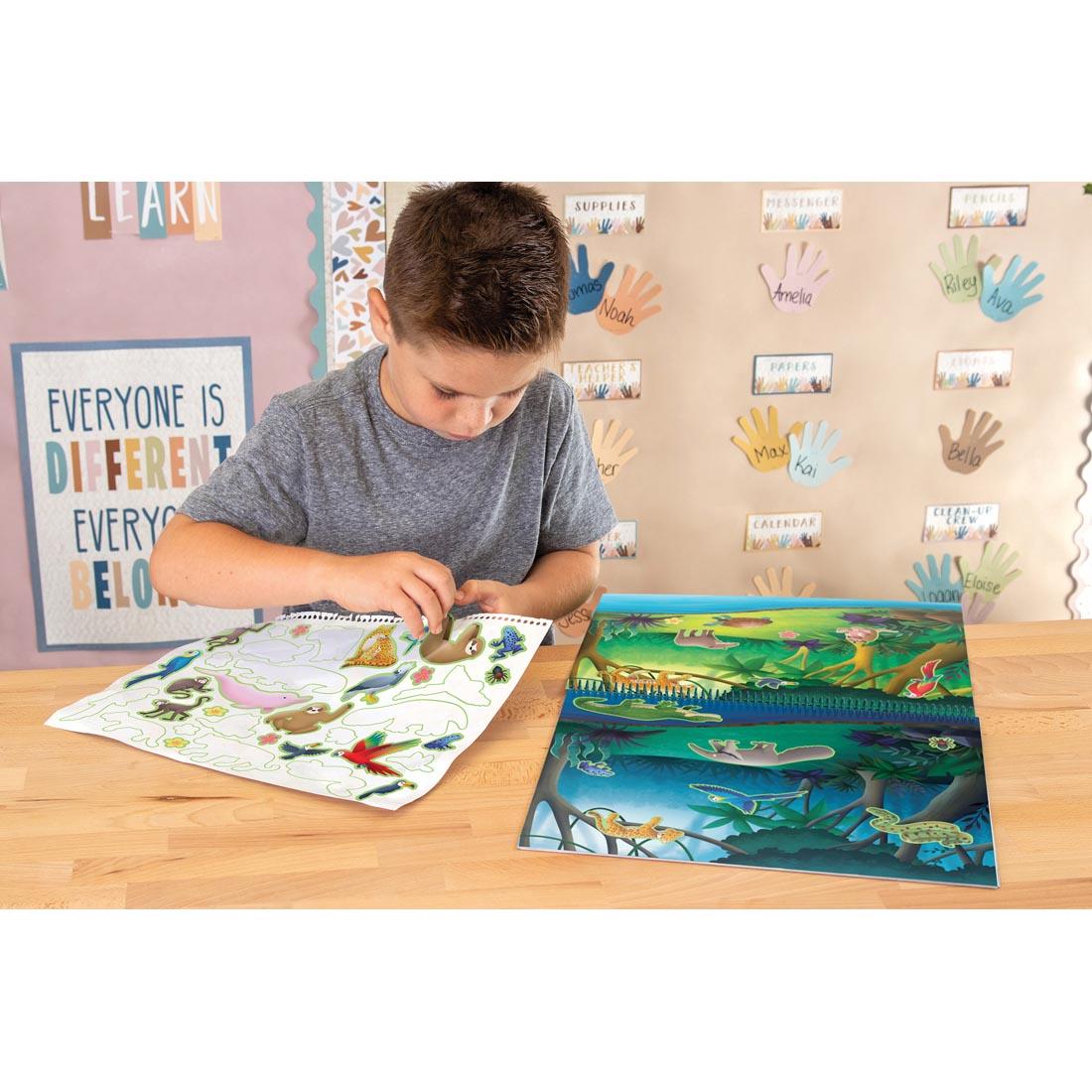 Child playing with the Animal Habitats Reusable Sticker Pad