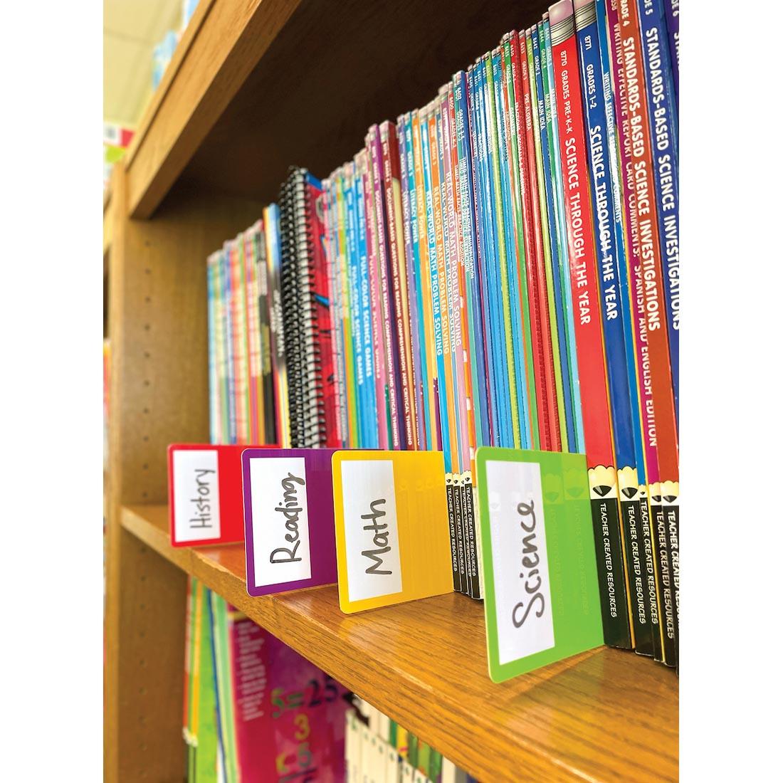 bookshelf with 4 Library Book Dividers By Teacher Created Resources in use