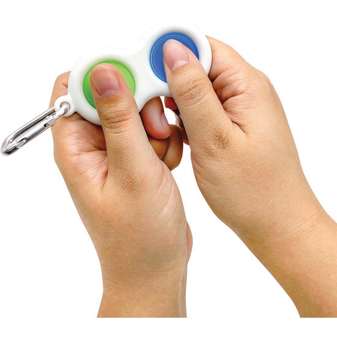 Person playing with the push and pop bubble keychain from the Fidgety Fidgets Box By Teacher Created Resources