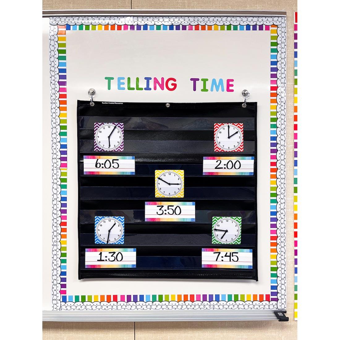 Teacher Created Resources Clocks in use in a pocket chart on a display board