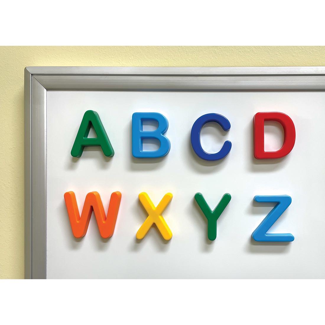 Eight Uppercase Magnetic Letters By Teacher Created Resources on a whiteboard