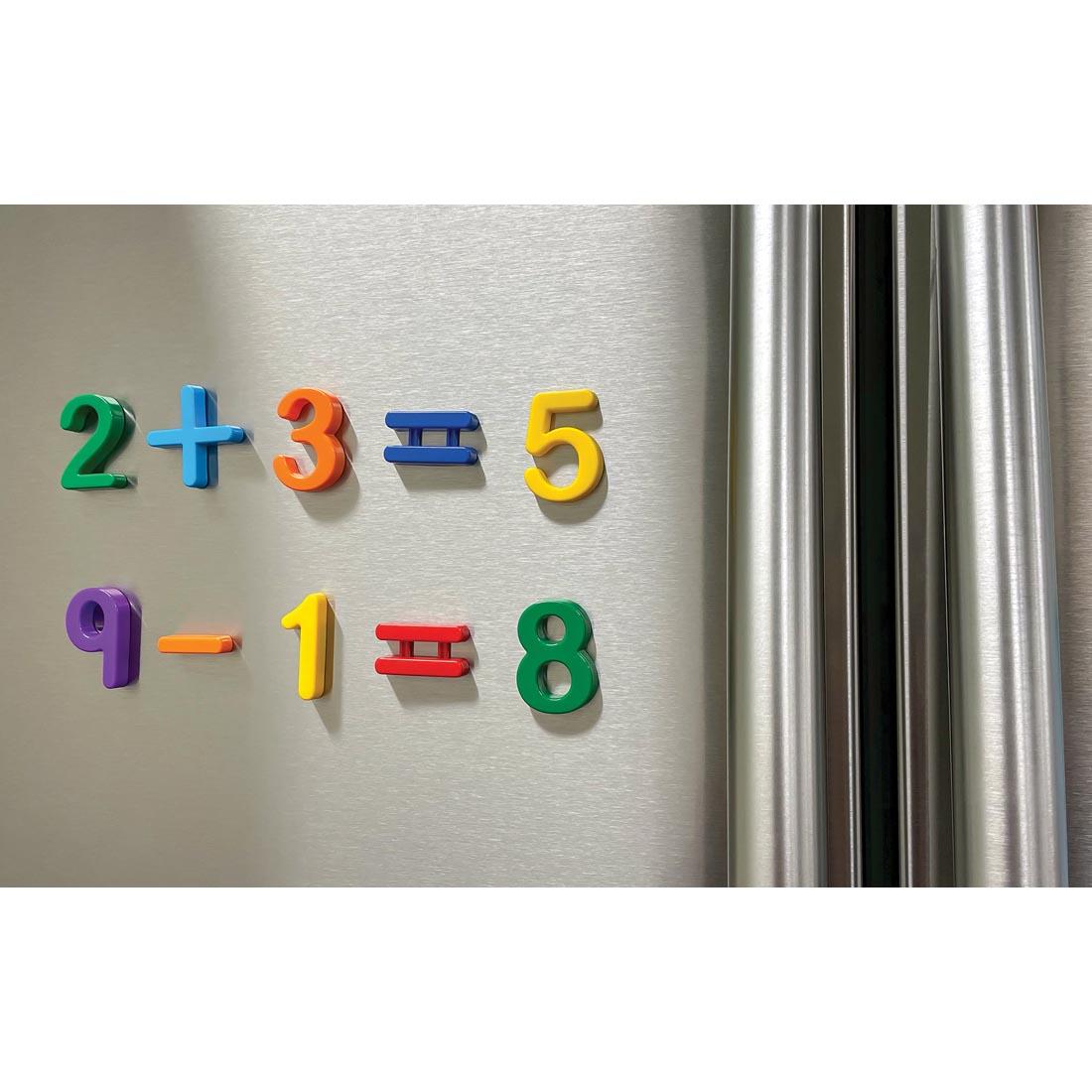 Magnetic Numbers And Symbols By Teacher Created Resources on a refrigerator