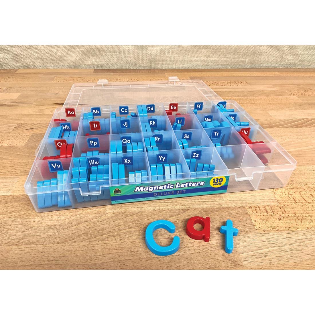 full case of Magnetic Letters Deluxe Set By Teacher Created Resources with lid open plus the letters used to spell cat