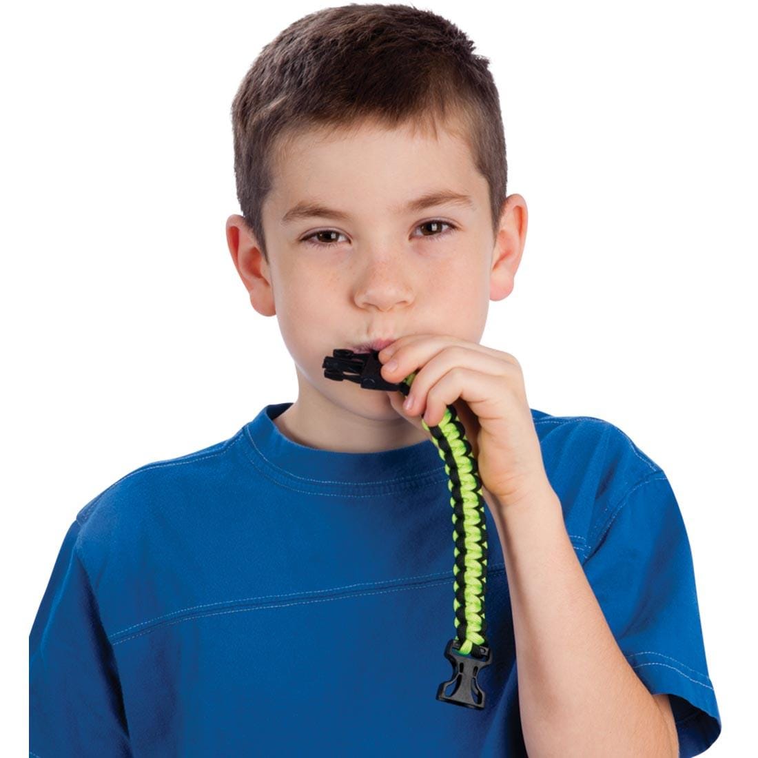 Child blowing the whistle on the Survival Bracelet With Safety Whistle