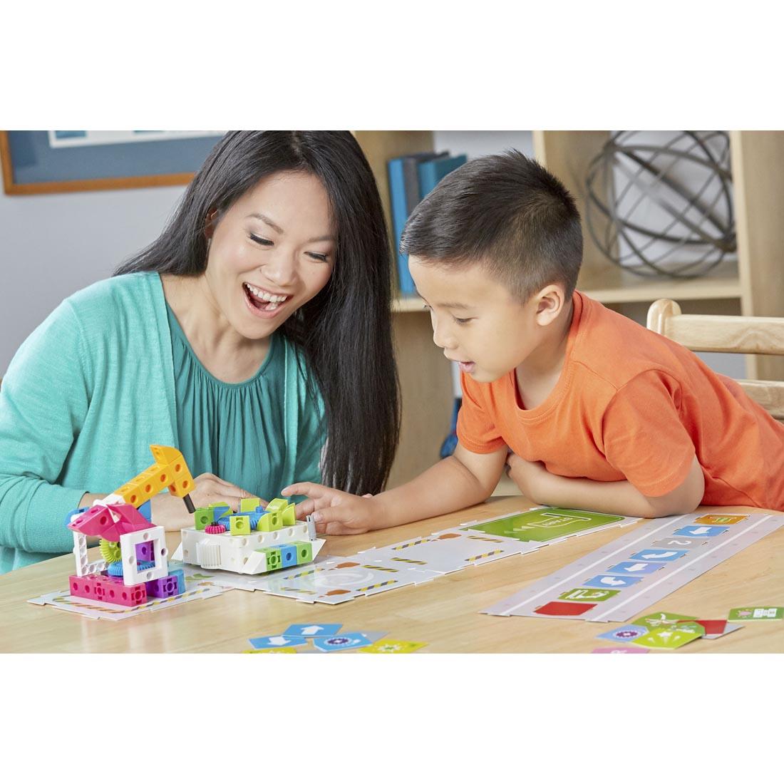 adult and child using Kids First Coding & Robotics