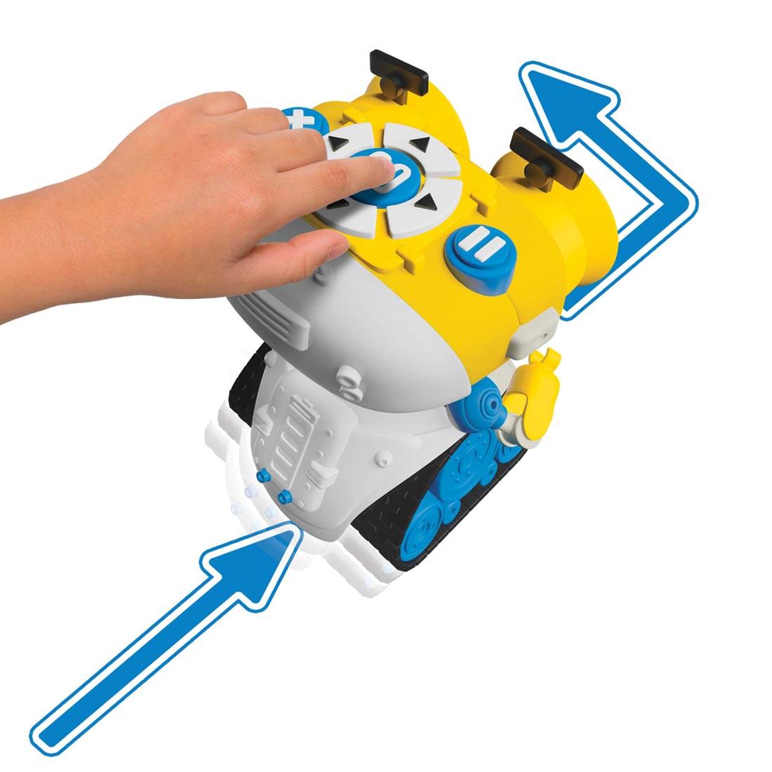 child's hand pressing a button on top of Kids First Andy: The Code & Play Robot