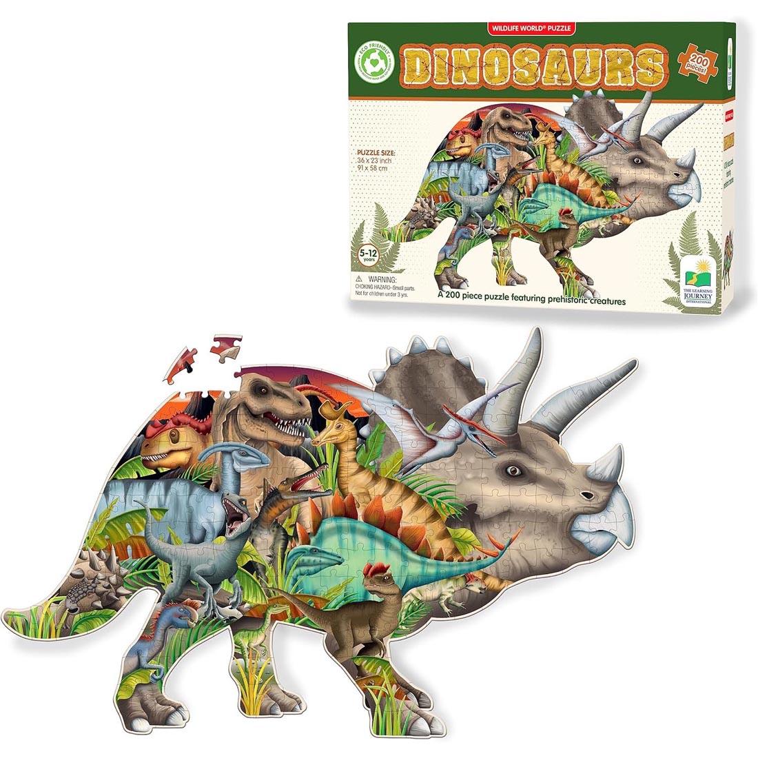 almost completed Wildlife World Dinosaurs 200-Piece Puzzle By The Learning Journey below its package