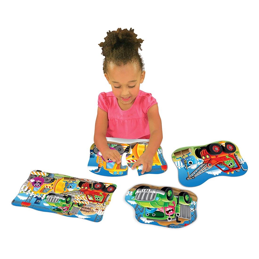 Child playing with My First Puzzles 4-In-A-Box Monster Truck Puzzles Set By The Learning Journey