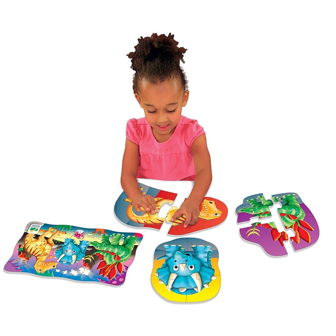 Child playing with the My First Puzzles 4-In-A-Box Dino Puzzles Set By The Learning Journey