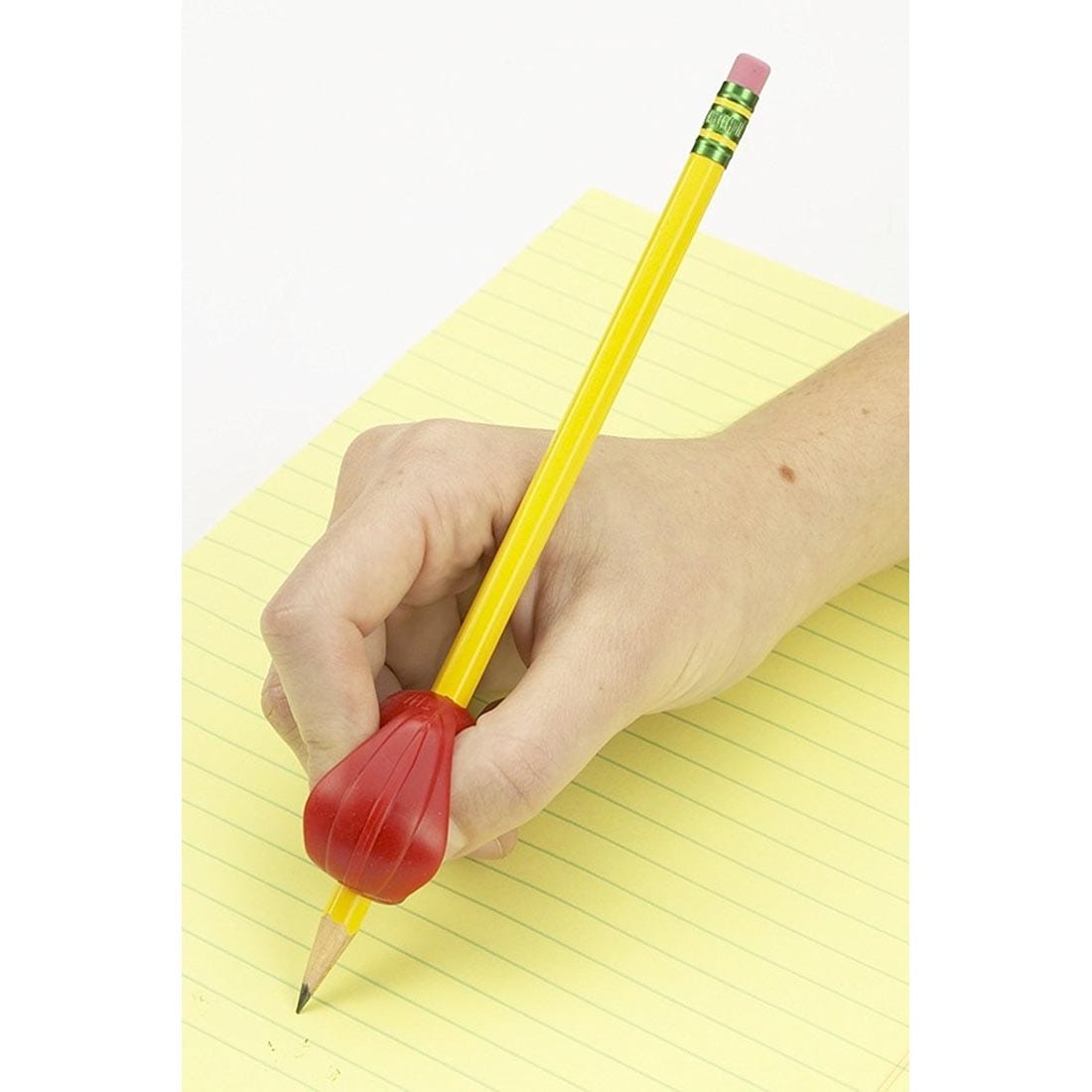 Hand using the The Pencil Grip Crossover Grip Classic on a pencil