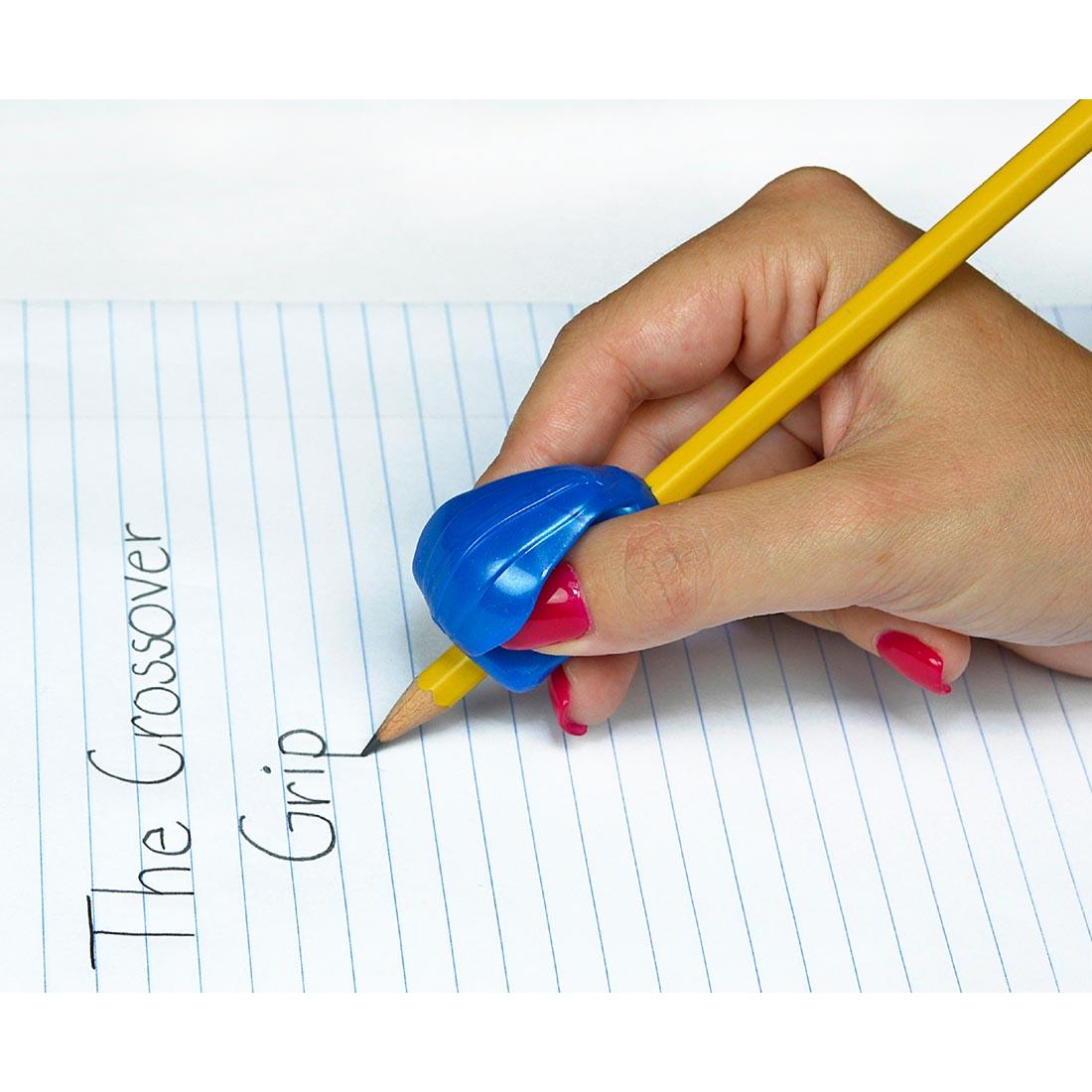 hand writing words on a page, using a pencil with The Pencil Grip Crossover Grip Classic