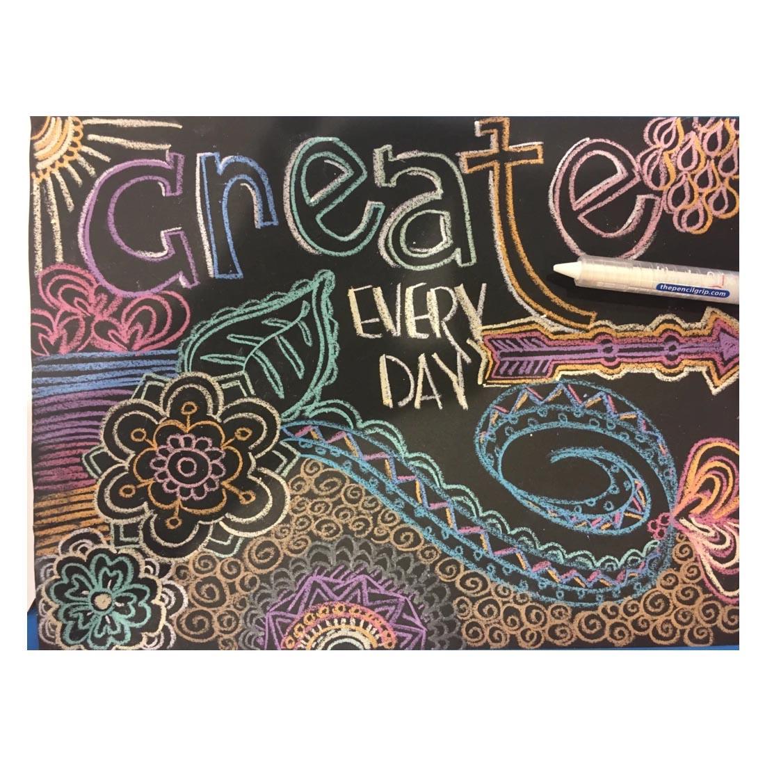 Drawing on a Playmat with Washable Wonder Stix with the words create every day