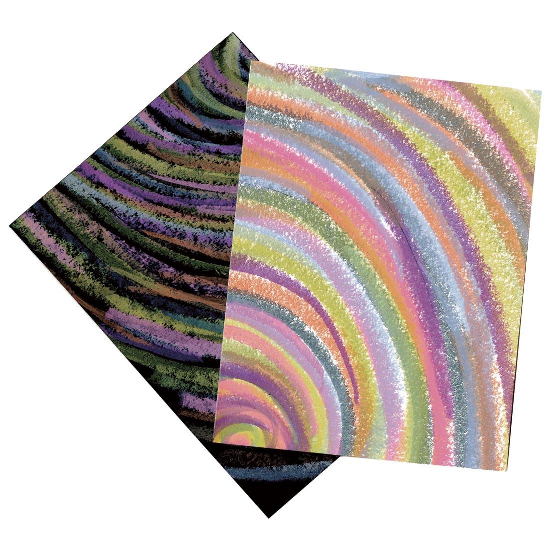 Sample artwork made with Kwik Stix solid tempera paint in pastel colors, shown on white paper and black paper