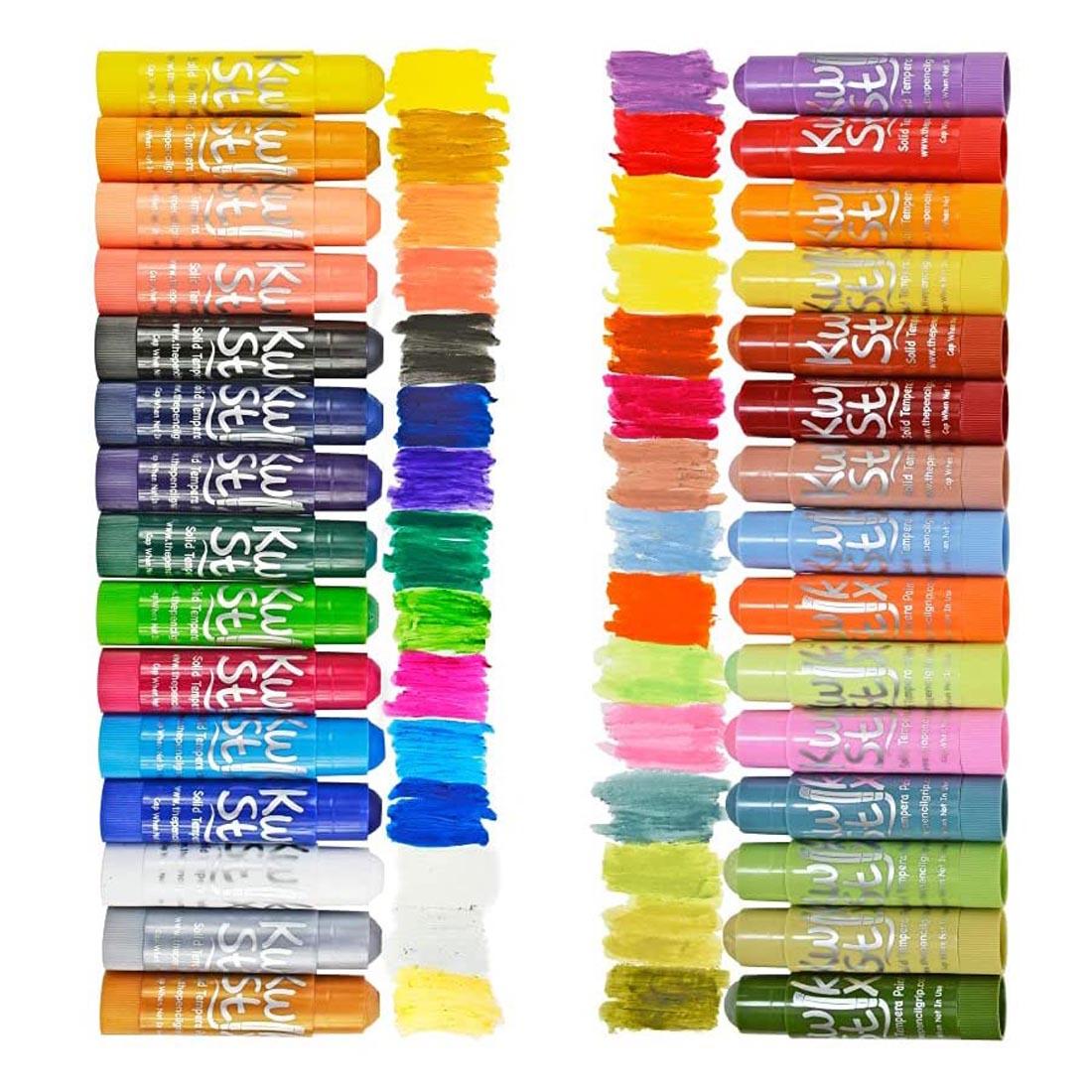 Kwik Stix Solid Tempera Paint 30-Color Set with lids off and a swatch of color next to each one