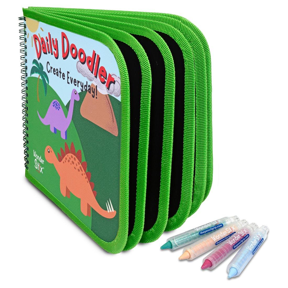 Dino Daily Doodler Reusable Activity Book standing up with four Wonder Stix
