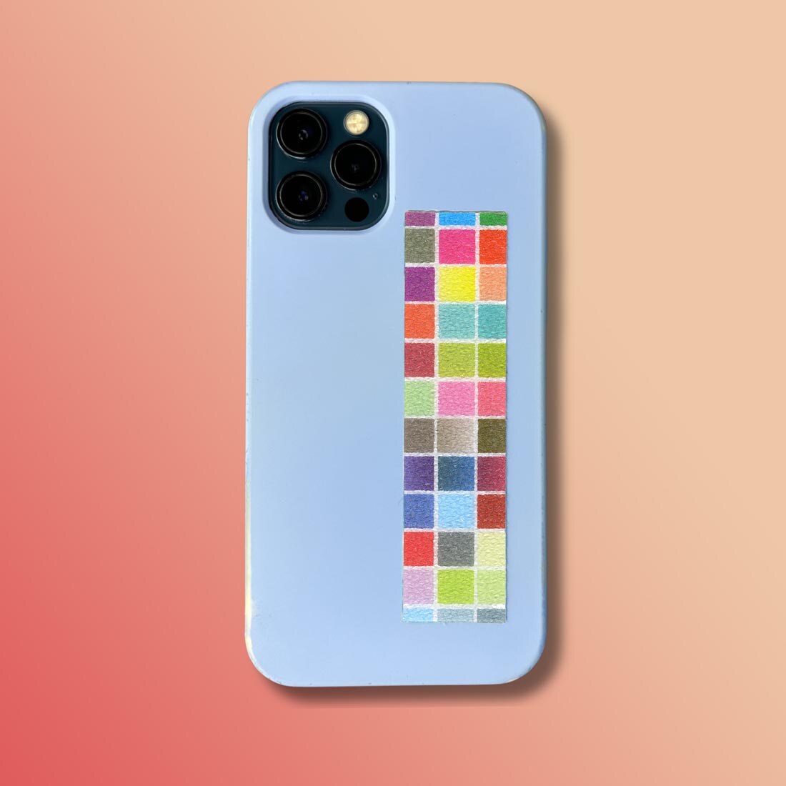 a Sandy Brights Zen Strip attached to the back of a cell phone case