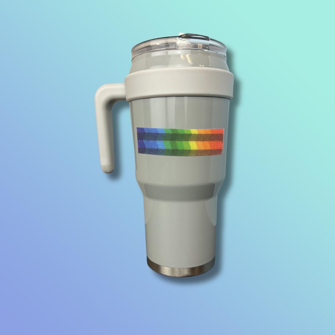 A Sandy Brights Zen Strip attached to a travel coffee mug