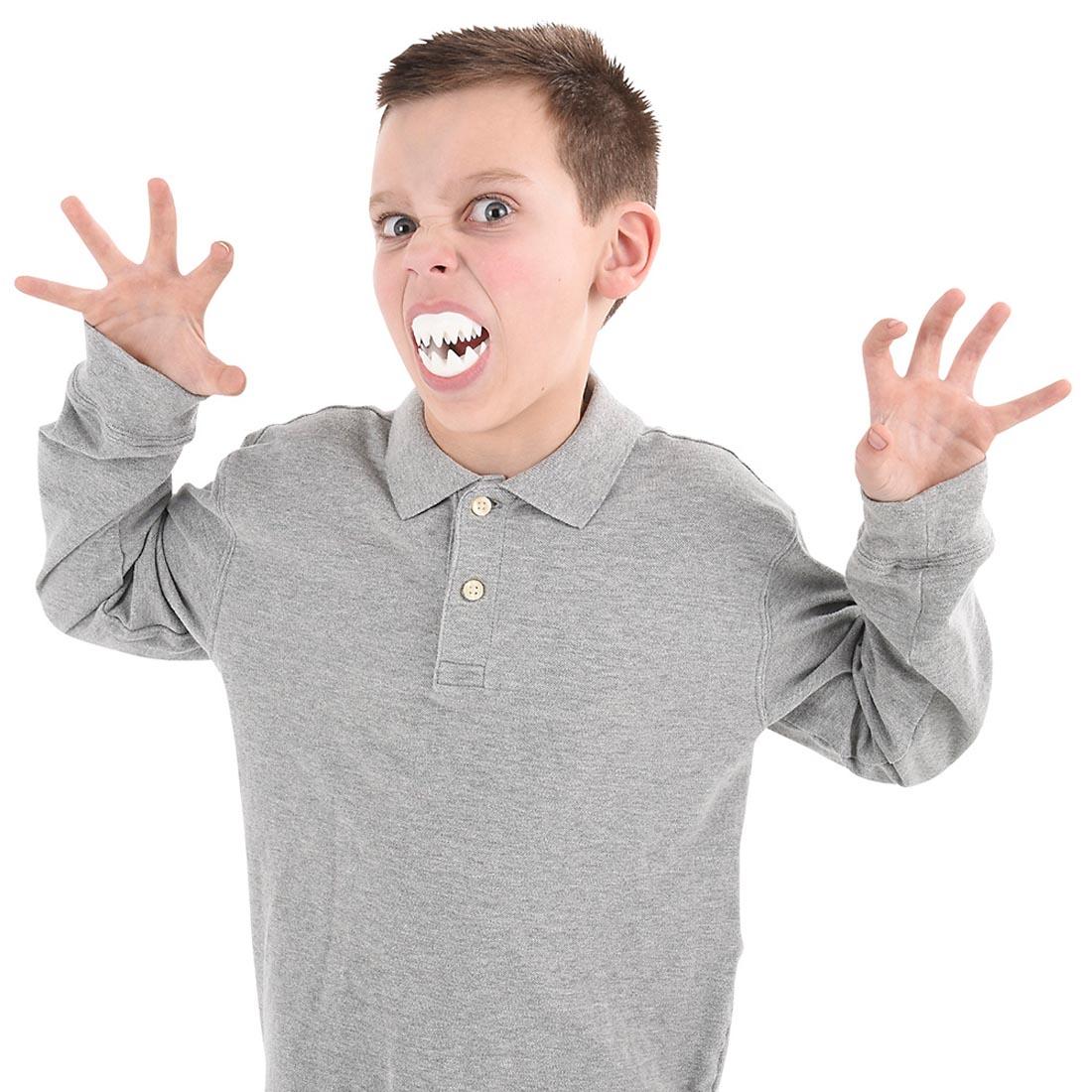 child with Great White Shark Teeth in mouth
