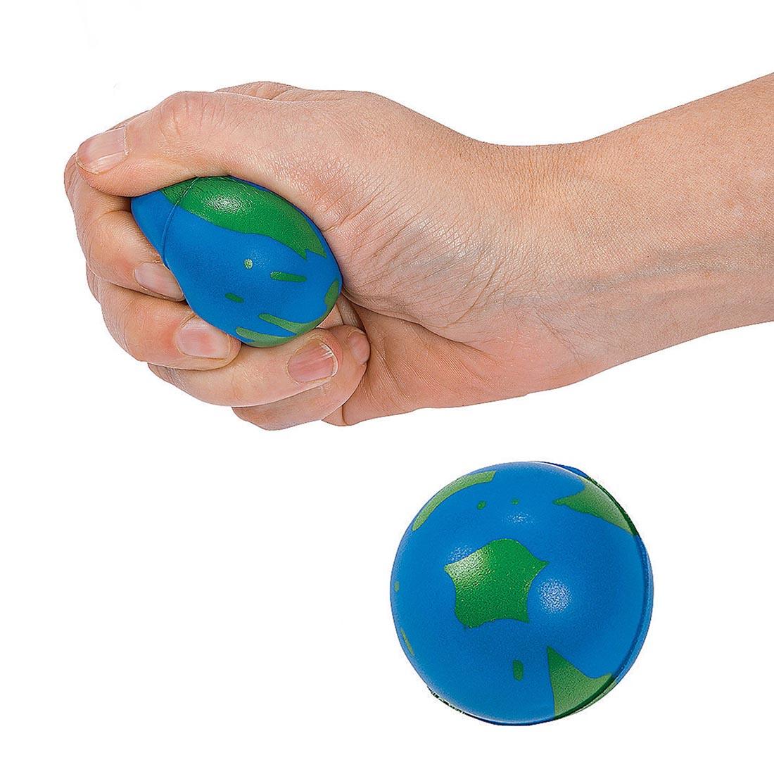 fist squeezing a Foam Globe Stress Ball by Fun Express