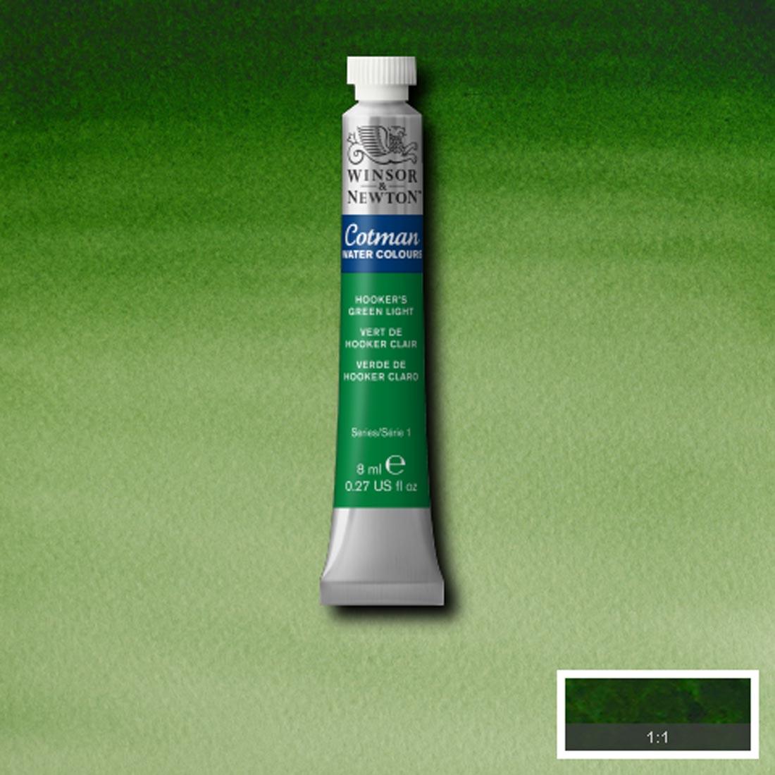 Tube of Hooker's Green Light Winsor and Newton Cotman Water Colour with a paint swatch for the background