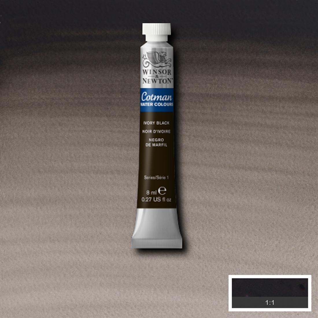 Tube of Ivory Black Winsor and Newton Cotman Water Colour with a paint swatch for the background